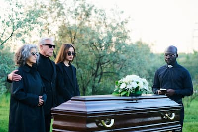 pastor-with-holy-bible-and-family-of-three-standin-2025-03-17-08-24-06-utc.jpg